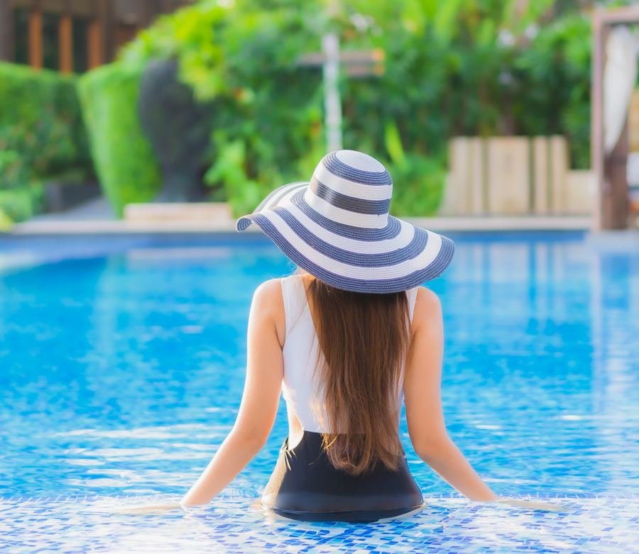Reference image of a resident relaxing in a swimming pool
